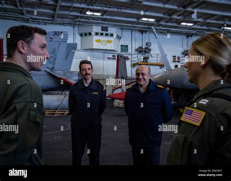 230408 N Sk738 2024 Mediterranean Sea April 8 2023 Lt Cmdr Russell Huff Maintenance Officer Carrier Air Wing 7 Left Gives A Tour To Spanish Navy Lt Carlos Arenas Left Center And Turkish Navy Capt