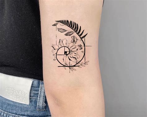 A Golden Spiral Tattoo Often Inspired By The Fibonacci Sequence And Golden Ratio Can Symbolize Mathematical Beauty Precision Harmony And The Cyclical Nature Of Life It Can Also Represent Growth Evolution And