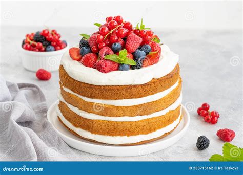 A Homemade Naked Layered Vanilla Cake Adorned With Whipped Cream And Fresh Berries Stock Image A Homemade Naked Layered Vanilla Cake Adorned With Whipped Cream And Fresh Berries Stock Image