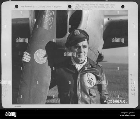 A Pilot Of The 94Th Fighter Squadron 1St Fighter Group Stands Beside