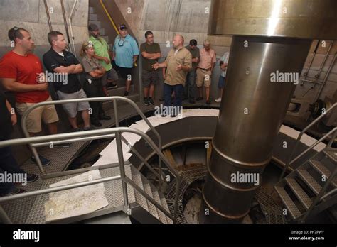 A Public Tour Group Gets An Up Close View Of A Generator Shaft During A