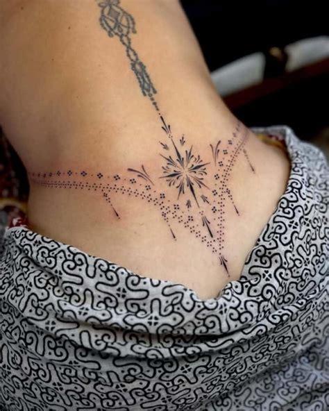 A Woman Amp 39 S Lower Back Tattoo With Birds In The Shape Of A Heart On Her