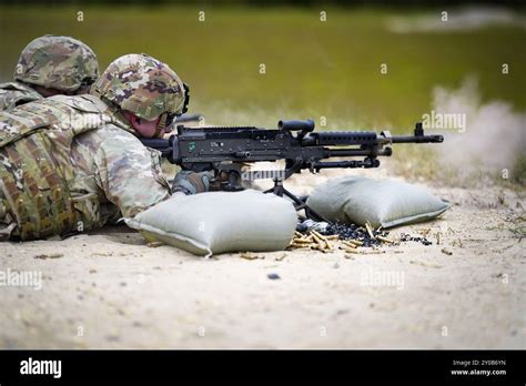 An Army Reserve Best Squad Competitor Fires An M240b Machine Gun During