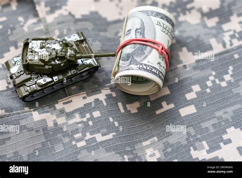 Army Identification Medallions And Dollar Bills On United States Flag