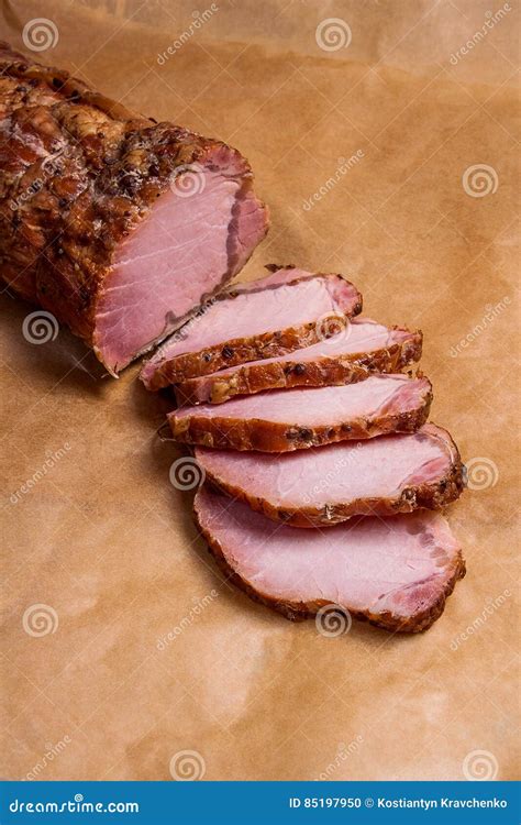 Close Up View Of Sliced Smoked Meat Or Ham On Brown Packing Paper Close Up View Of Sliced Smoked Meat Or Ham On Brown Packing Paper