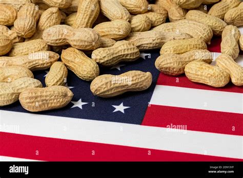 Closeup Of Peanuts In Shell On Flag Of United States Of America With