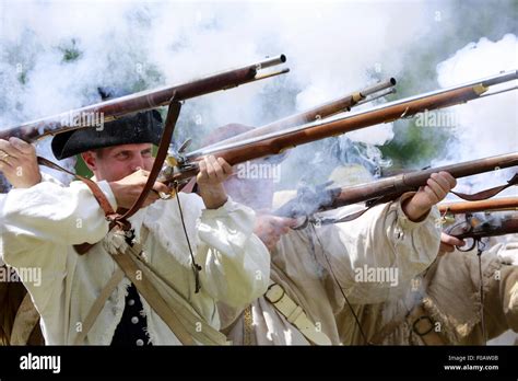 Continental Army Soldiers Firing Muskets During Revolutionary War Continental Army Soldiers Firing Muskets During Revolutionary War