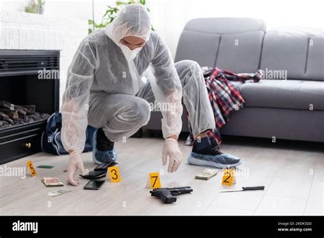Crime Scene Investigation Collecting Pistol And Cartridges By Crime Scene Investigation Collecting Pistol And Cartridges By