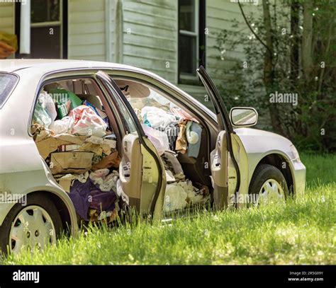 Detail Image Of A Four Door Vehicle Full Of Trash Stock Photo Alamy