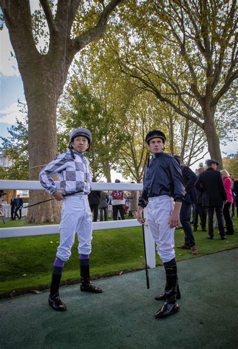 Download Ryan Moore Striking A Powerful Swing On A Sunny Day Wallpaper