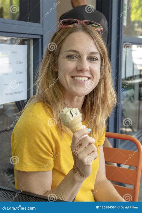 Forty Five Year Old Woman Enjoying And Ice Cream Cone On Family Forty Five Year Old Woman Enjoying And Ice Cream Cone On Family