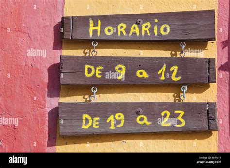 Horario Or Opening Hours Notice In The Spanish Language Outside A