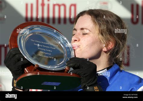 Jockey Lizzie Kelly Celebrates With The Trophy After Winning The Ultima