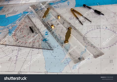 Maps Of The Ship And On Them A Ruler And Divider For Plotting The