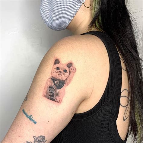 Micro Realistic Maneki Neko Tattoo Located On The
