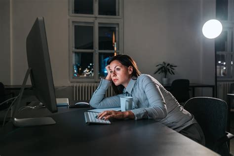 Premium Photo Exhausted Young Woman At Home Office Desk Working Late