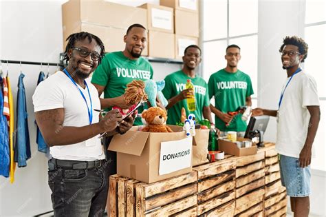 Premium Photo Group Of Young African American Volunteers Helping