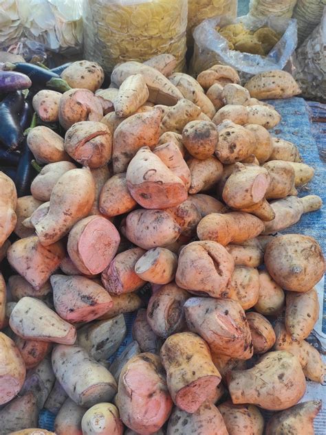 Premium Photo Raw Sweet Potatoes For Sale At A Market