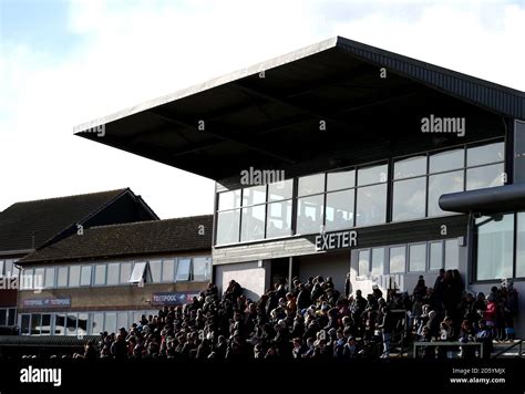 Racegoers In The Grandstand During Super Sunday At Exeter Racecourse Racegoers In The Grandstand During Super Sunday At Exeter Racecourse