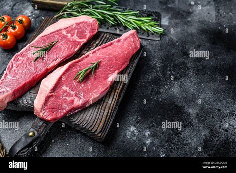 Raw Top Sirloin Cap Or Picanha Steak Black Background Top View Stock