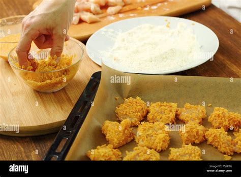 Roll Floured Egged Chicken Fillet In Corn Flake Crumbs Making Oven