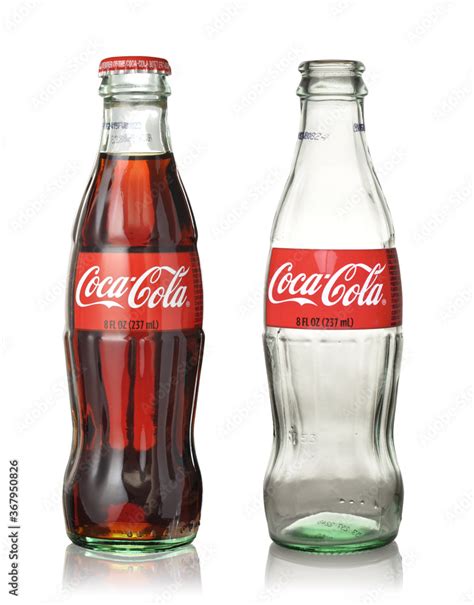 Set Of Half Empty Coca Cola Glass Bottles In A Red Coca Cola Box
