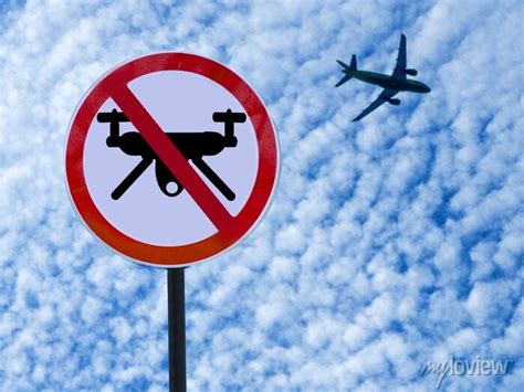 Sign Ban Drones On Sky Background With Clouds And Taking Off Plane