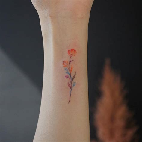 Small Watercolor Flower Tattoo On The Wrist Small Watercolor Flower Tattoo On The Wrist