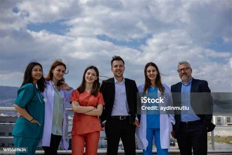 Smiling Medical Team Standing Together Outside A Hospital Tri City
