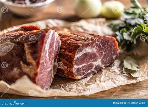Smoked Pork Neck Cut Into Two Parts Ready For Heat Treatment Stock