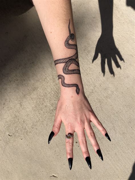 Snake Tattoo Wrapped Around Arm Tattoo Style Trends