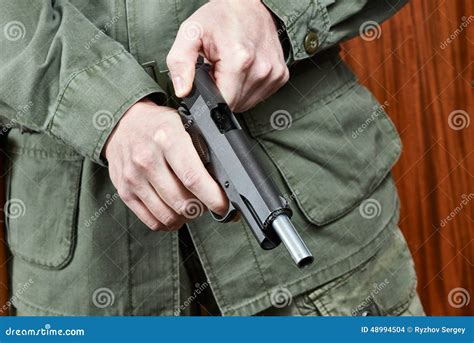 Soldier Shutter Cocking Pistol Gun Royalty Free Stock Image