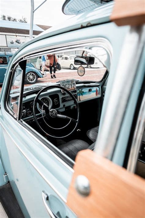 Steering Wheel Of Old Fashioned Volkswagen Beetle Seen Through Opened Side Window Free Stock Photo
