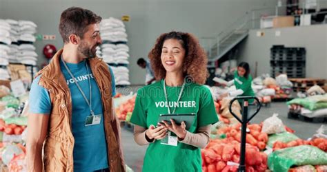 Tablet Talking And Volunteers At Food Drive Donation For Community