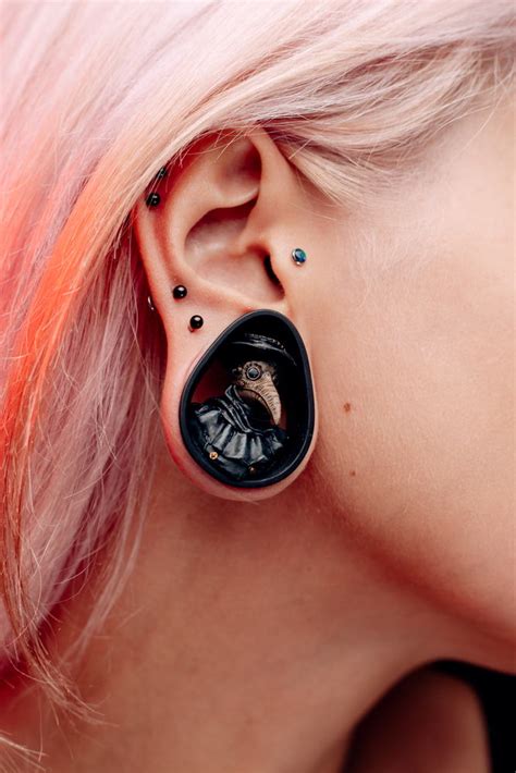 The Art Of Body Modification How Piercings Tattoos And Ear Tunnels