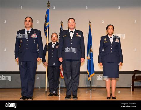 U S Air Force Col Jason Vattioni Left 377Th Air Base Wing Installation Commander And Presiding Official Lt Col Shay Edwards Center Outgoing 377Th Comptroller Squadron Commander And Maj Karim Rodriguez Right Incoming