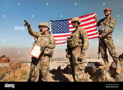 U S Army Soldiers Hold The American Flag Atop Pride Rock Mountain In Afghantistan Stocktrek Images U S Army Soldiers Hold The American Flag Atop Pride Rock Mountain In Afghantistan Stocktrek Images