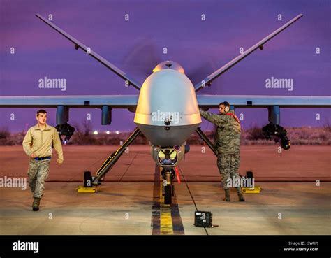 U S Soldiers Secure A Usaf Mq 9 Reaper Unmanned Aerial Vehicle U S Soldiers Secure A Usaf Mq 9 Reaper Unmanned Aerial Vehicle