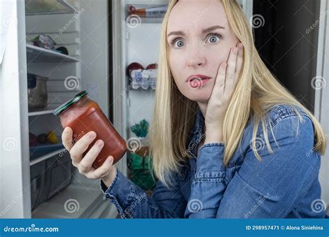 Woman Reads Instructions For Food Products At Home Checking Labels On