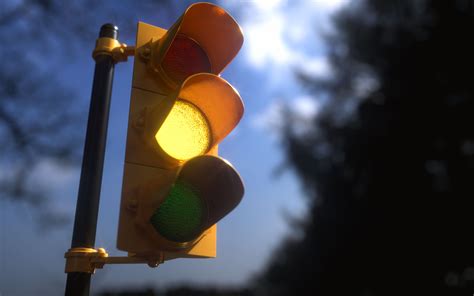 Understanding the Yellow Stop Light: Causes, Significance, and Safe Reactions