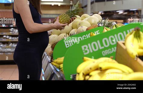 Young Woman Buying Organic Grocery In Health Food Store Stock Clip Young Woman Buying Organic Grocery In Health Food Store Stock Clip